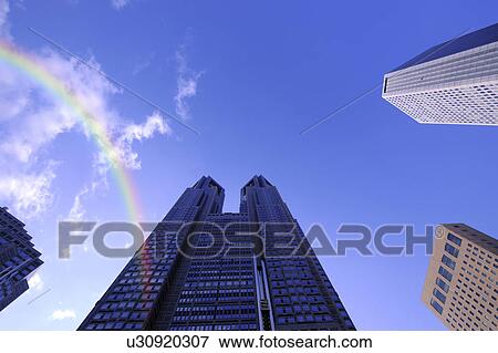 Stock Photo - A rainbow and the Tokyo Metropolitan Government Offices, Shinjuku-ku, Tokyo, Japan. Fotosearch