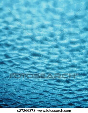 Stock Image - Abstract textured blue background. Fotosearch