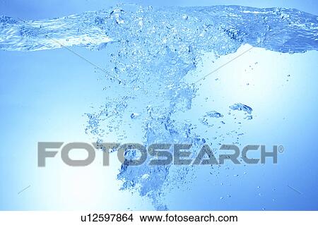 Picture - Air bubbles in water, close up, blue background. Fotosearch