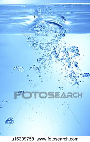 Stock Photo - Air bubbles in water, close up, blue background. Fotosearch