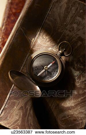 Antique compass on book View Large Photo Image Stock Photo - Antique compass on book. Fotosearch