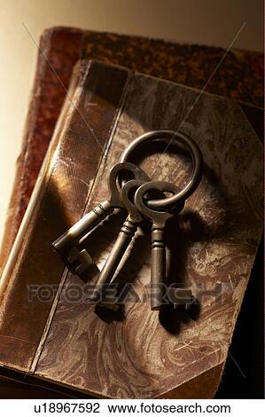 Stock Image - Antique keys on books. Fotosearch