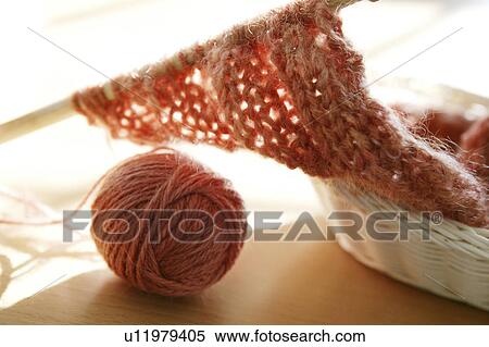 Stock Photography - Ball of yarn and knitting. Fotosearch