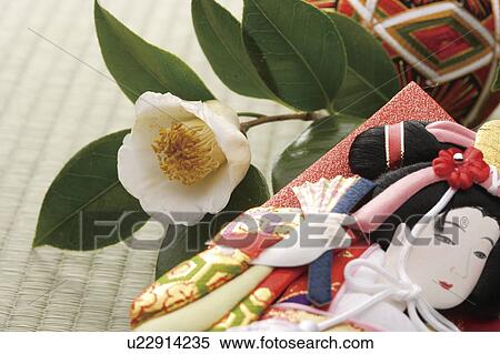 Stock Photography - Battledore, camellia and a temari ball. Fotosearch
