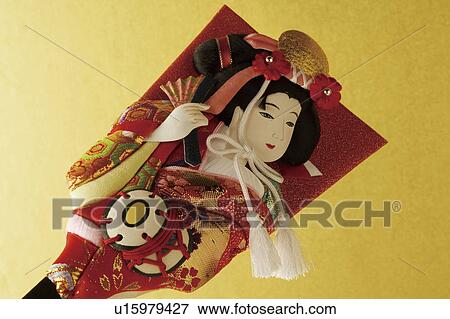 Stock Photo - Battledore decorated with Kabuki performer. Fotosearch