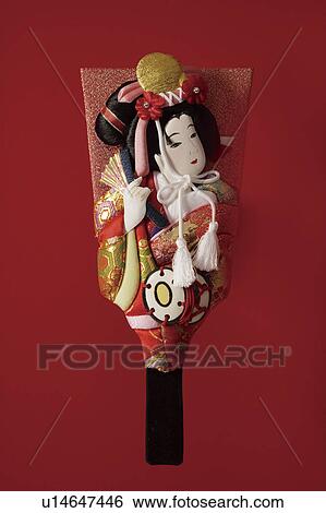 Stock Photograph - Battledore decorated with Kabuki performer. Fotosearch