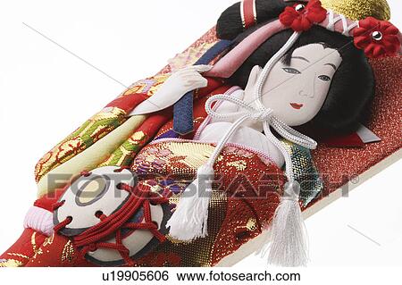 Stock Photograph - Battledore decorated with Kabuki performer. Fotosearch