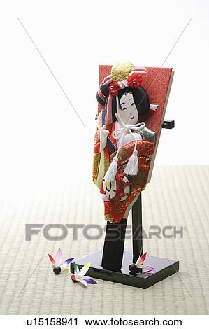 Stock Image - Battledore on a stand with Japanese shuttlecocks. Fotosearch