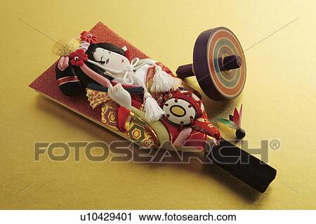 Stock Image - Battledore, shuttlecock and a top. Fotosearch