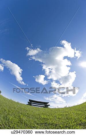 Stock Image - Bench in field, Tochigi Prefecture, Honshu, Japan. Fotosearch
