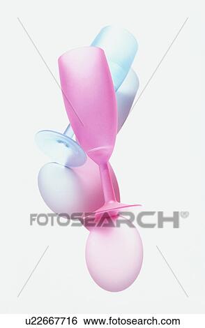 Blue and pink champagne flutes on white background View Large Photo Image Stock Photograph - Blue and pink champagne flutes on white background. Fotosearch