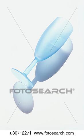 Stock Image - Blue champagne flute on white background. Fotosearch