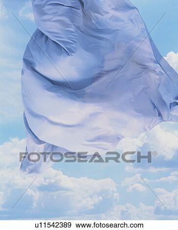 Blue cloth floating in the sky View Large Photo Image Stock Photo - Blue cloth floating in the sky. Fotosearch