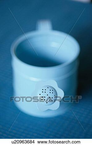 Picture - Blue watering can. Fotosearch