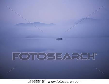 Boat on a lake surrounded by morning fog, Chuzenji river, Kanto, Nikko, Tochigo Prefecture, Japan View Large Photo Image Stock Image - Boat on a lake surrounded by morning fog, Chuzenji river, Kanto, Nikko, Tochigo Prefecture, Japan. Fotosearch