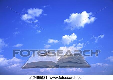 Book and pocketwatch in a blue sky View Large Photo Image Stock Image - Book and pocketwatch in a blue sky. Fotosearch