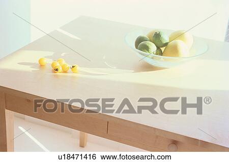 Bowl of fruit and yellow cherry tomatoes on table View Large Photo Image Stock Photograph - Bowl of fruit and yellow cherry tomatoes on table. Fotosearch