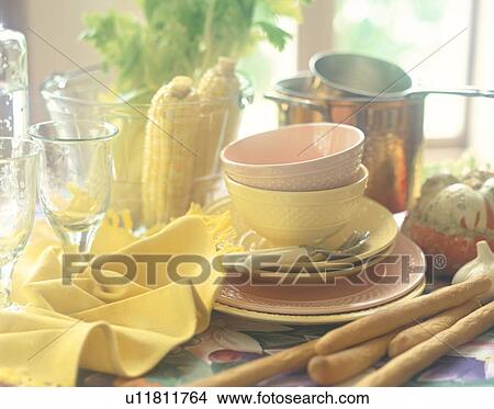 Picture - Bowls, glasses and food on table. Fotosearch