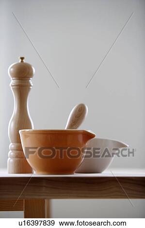 Bowls next to a pepper mill View Large Photo Image Stock Photo - Bowls next to a pepper mill. Fotosearch
