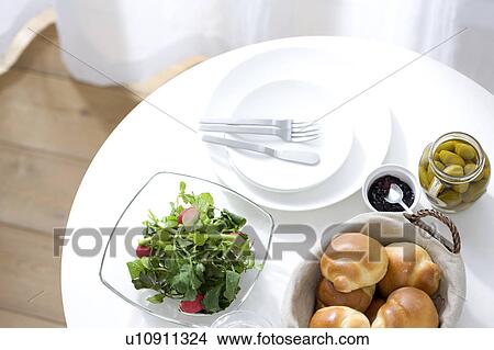 Picture - Bread and salad on a table. Fotosearch