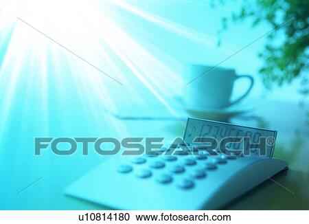 Burst of light over a calculator and coffee cup View Large Photo Image Stock Image - Burst of light over a calculator and coffee cup. Fotosearch