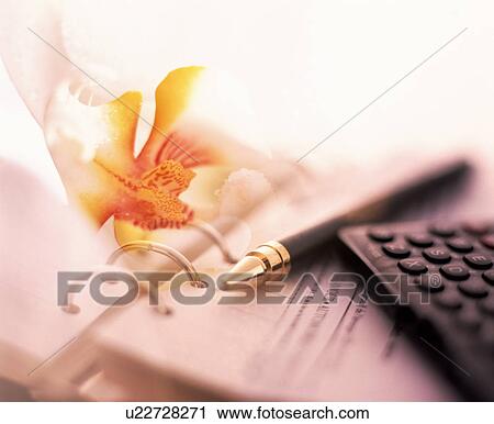 Stock Image - Business diary with pen calculator and an orange orchid. Fotosearch