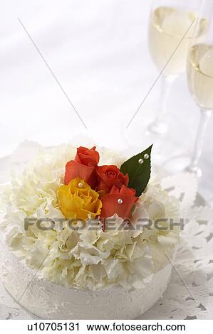 Stock Image - Cake with flowers on top. Fotosearch
