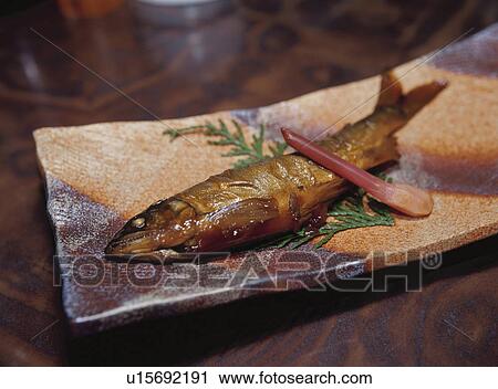 Stock Image - Candied sweetfish on plate. Fotosearch