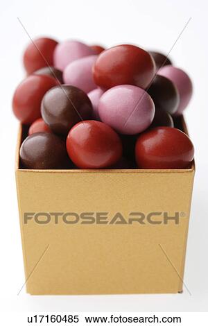 Candy covered chocolates in a box View Large Photo Image Stock Photography - Candy covered chocolates in a box. Fotosearch