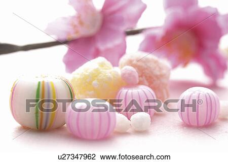 Stock Image - Candy with pink peach flowers. Fotosearch