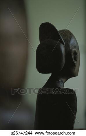 Picture - Carved wooden female head. Fotosearch