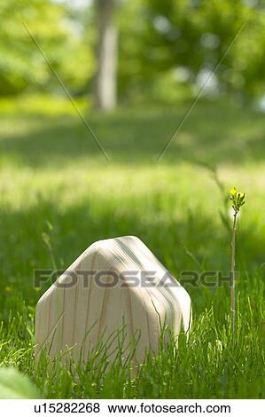 Carved wooden house in the grass View Large Photo Image Stock Photo - Carved wooden house in the grass. Fotosearch