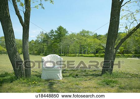 Stock Image - Chair in a field, Karuizawa, Nagano Prefecture, Japan. Fotosearch