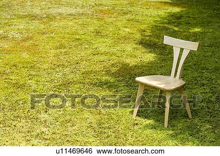 Chair in a park View Large Photo Image Stock Photograph - Chair in a park. Fotosearch