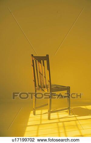 Chair in yellow room View Large Photo Image Stock Image - Chair in yellow room. Fotosearch