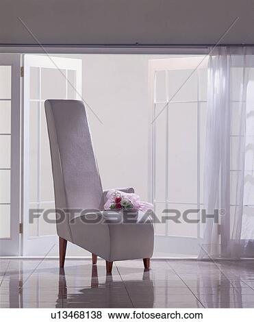 Stock Photo - Chair with bouquet of flowers. Fotosearch