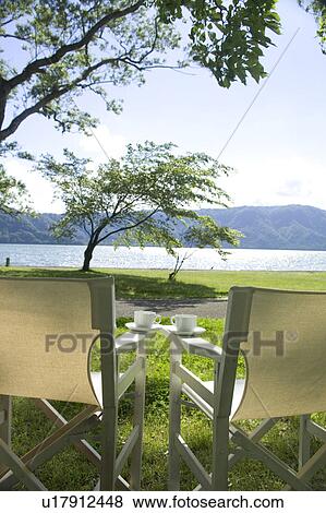 Stock Photo - Chairs in a park by the lake, Towada, Aomori Prefecture, Japan. Fotosearch