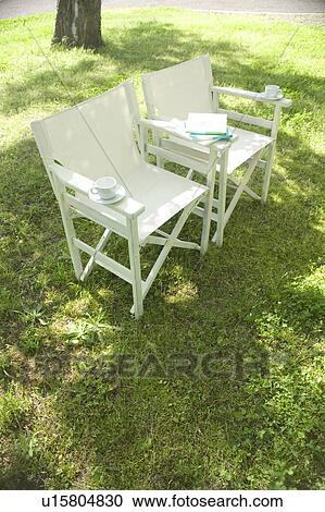 Stock Image - Chairs on a lawn. Fotosearch