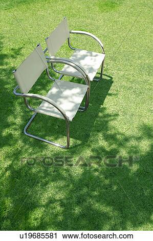 Stock Image - Chairs on a lawn. Fotosearch