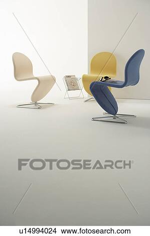 Chairs with headphones and magazine rack View Large Photo Image Picture - Chairs with headphones and magazine rack. Fotosearch