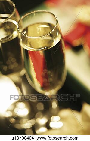 Picture - Champagne and Christmas presents. Fotosearch