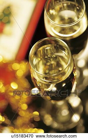 Stock Image - Champagne and Christmas presents. Fotosearch