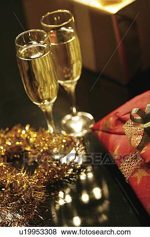 Stock Photo - Champagne and Christmas presents. Fotosearch