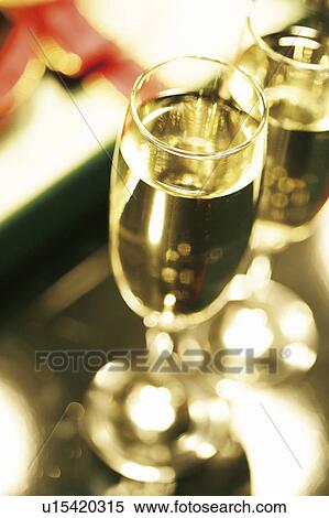 Stock Photography - Champagne and Christmas presents. Fotosearch