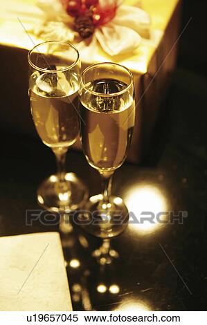 Stock Photography - Champagne and Christmas presents. Fotosearch