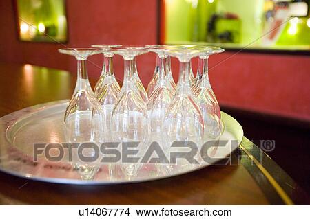Champagne flutes on silver tray View Large Photo Image Picture - Champagne flutes on silver tray. Fotosearch