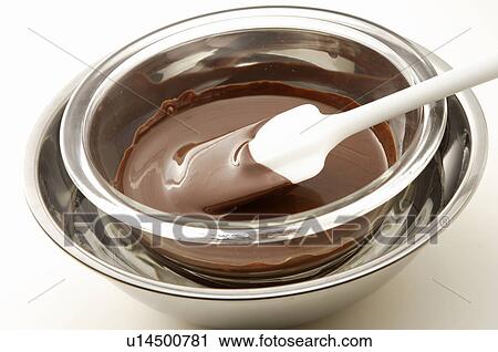 Chocolate being melted in a bowl View Large Photo Image Stock Image - Chocolate being melted in a bowl. Fotosearch