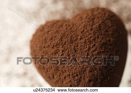 Picture - Chocolate heart covered in cocoa powder. Fotosearch