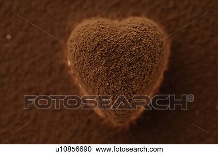 Chocolate heart covered in cocoa powder View Large Photo Image Stock Image - Chocolate heart covered in cocoa powder. Fotosearch