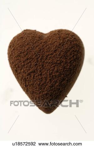 Stock Image - Chocolate heart covered in cocoa powder. Fotosearch
